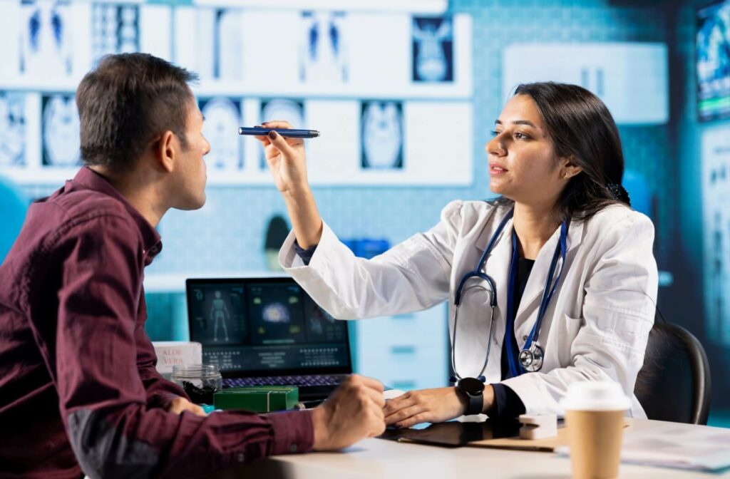 Optometrist performing a vision test in a clinical office. Patient undergoing an eye exam, an optometrist using diagnostic tools for eyesight correction and treatment in a consultation.